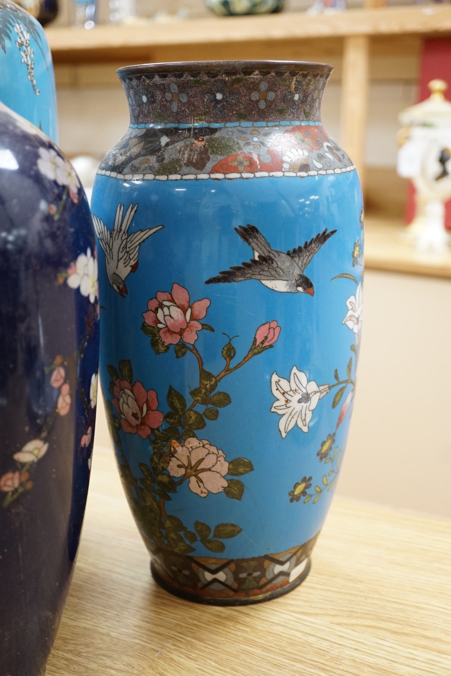 Seven Japanese cloisonné enamel vases, enamelled with dragons, flowers and birds, largest 40cm high